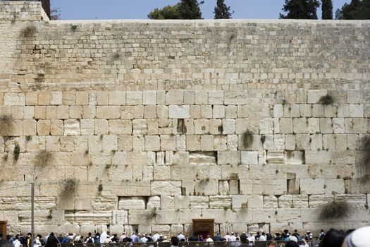 praying at the western wall in jerusalem