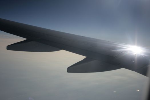 the sun reflection from airplane wing