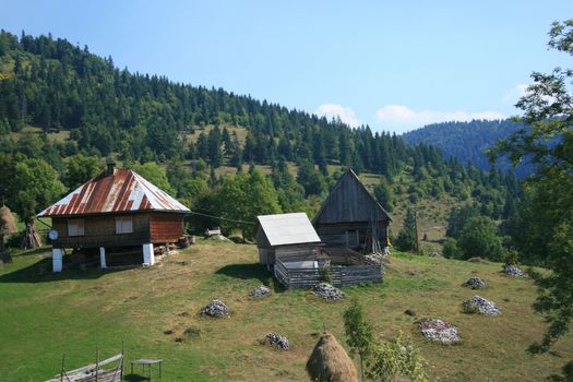 a small farm on the mountain side