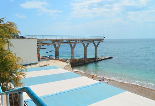 beautiful view of the beach, sea and pier, beach recreation and tourism concept.