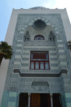 Authentic old beautiful house in Arabic style with carved stone facade.