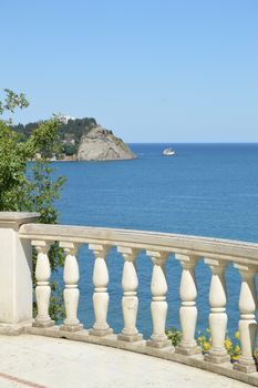 Beautiful seascape, view from white stone balustrade on Sunny summer day.
