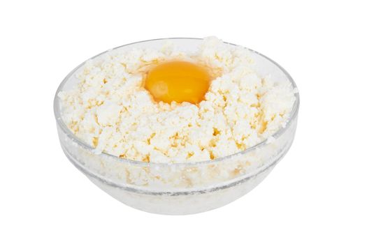 Cottage cheese with egg in glass bowl on a white background 