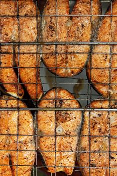 Fried sea fish. Preparation on open fire