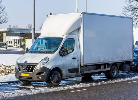 parked white truck during winter, logistics and transportation business, vehicles and equipment