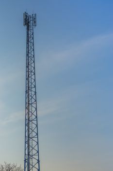 signal transmission tower with a blue sky in the background, modern technology