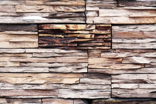 Nice house wall made from lot of various wooden slices