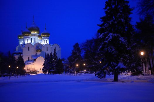 Nice winter landscape at night with white classical Russian church