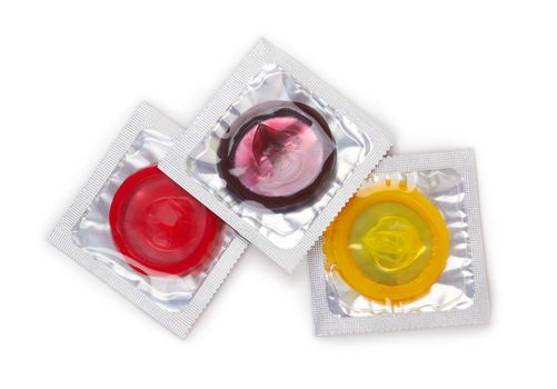 Colorful condoms isolated on white background