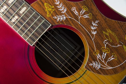 red western guitar music instrument with the strings in close up