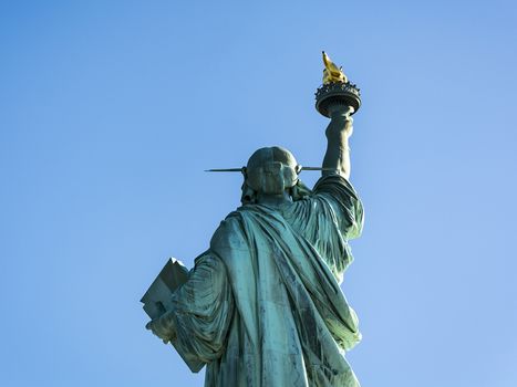 Back view of the Statue of Liberty at Liberty Island, Manhattan, New York, USA