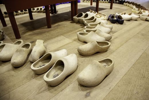 Dutch clogs craftsmen, manufacture of traditional footwear for the field