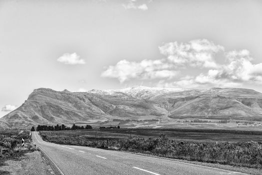 Monochrome landscape on road R46 near Ceres in the Western Cape Province. Snow is visible on the Theronsberg Mountains