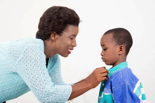 This smiling mother cares for her son.