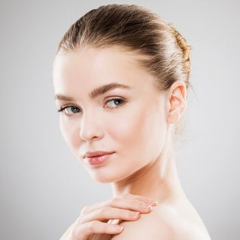 Beauty woman face portrait. Beautiful spa model girl with perfect fresh clean skin. Youth and skin care Concept