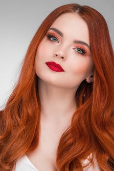 Portrait of young woman with long beautiful ginger hair