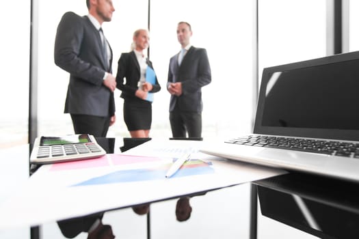 Group of people in business meeting working with documents with diagrams showing successful results