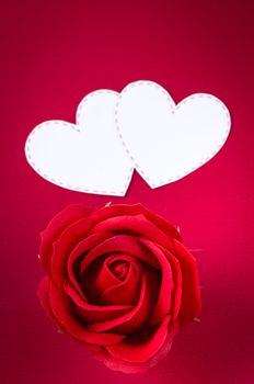 Red rose and white heart on red background, Valentine concept.