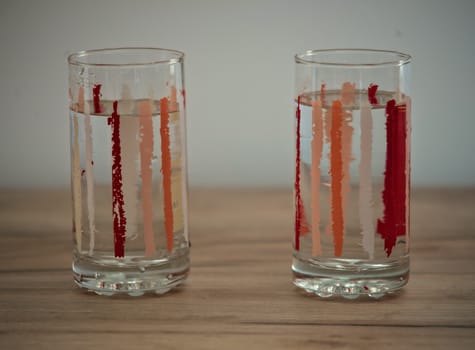 Two glasses of water on wooden table