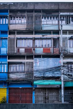 Facade of an old row house in Bangkok, Thailand