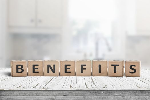 Benefits on a worn table in a bright room made with wooden blocks