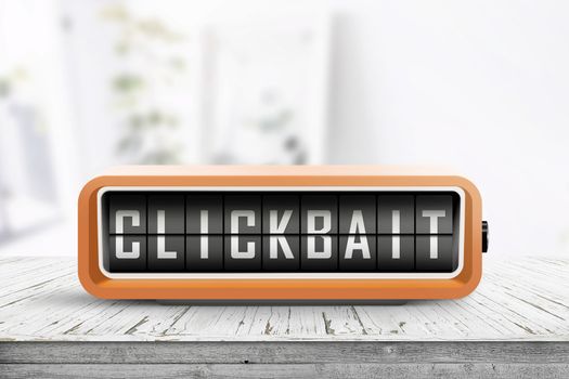 Clickbait text on a digital device in orange color in a bright room