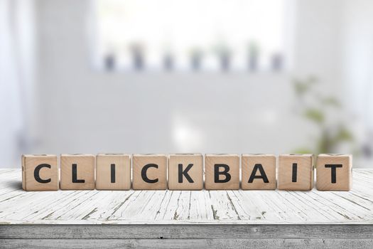 Clickbait word on a wooden sign in a living room with bright daylight