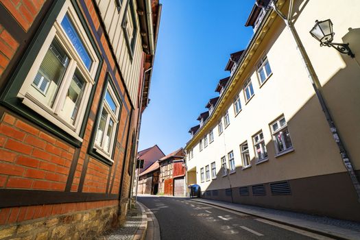 Old buildings on a village street in Harz in Germany on a summer day with blue sky