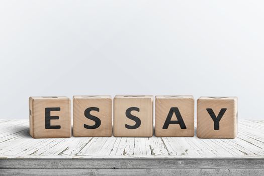 Essay note on a white table in a bright room made of wooden blocks