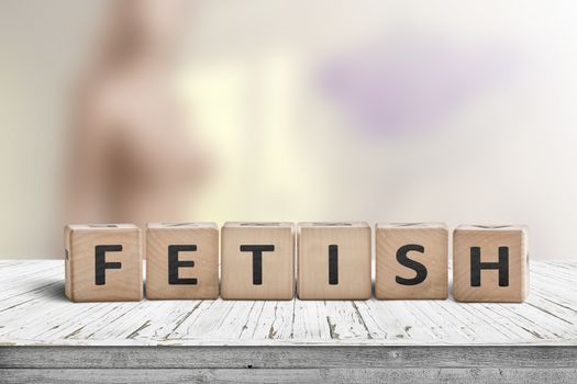 Fetish word on wooden cubes on a table with a blurry background