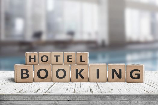 Hotel booking sign on a wooden step with blurry background of a residental suite