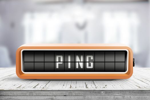 Retro device with the word Ping on a wooden table in a room