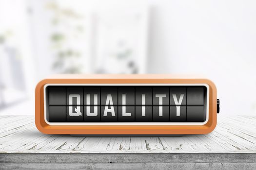 Retro device with the word quality displayed on a wooden table in a bright living room