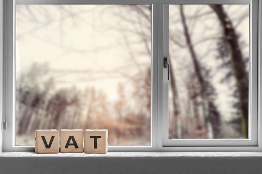 VAT sign on a window sill in the morning sunrise on a bright day