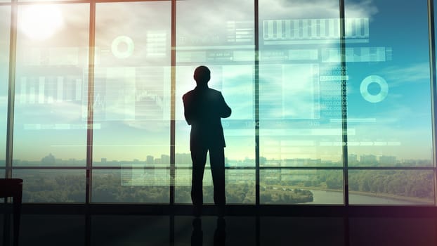 In an office with large windows, there is a silhouette of a trader looking at an infographic showing the exchange area and trading data.