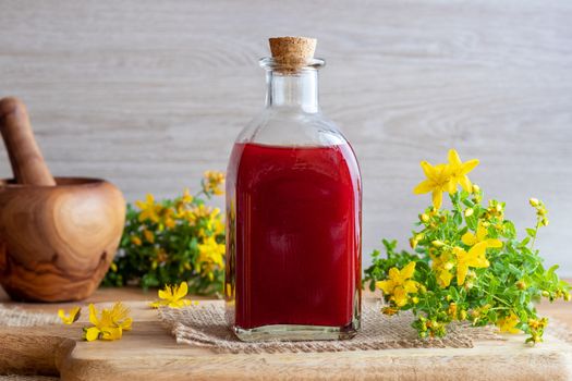 A bottle of red oil made from St. John's wort flowers