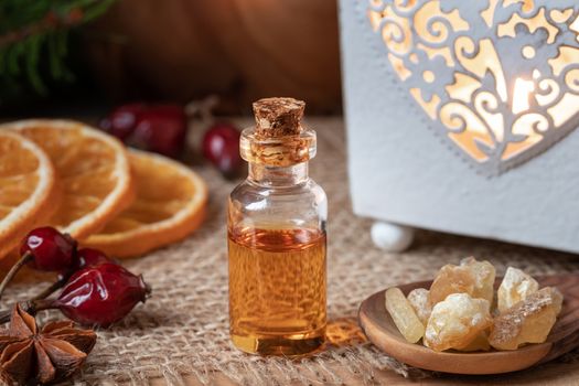 A bottle of essential oil with frankincense resin