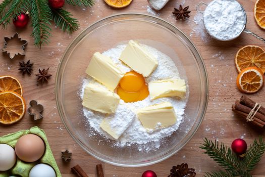 Flour, sugar, egg yolk and butter - ingredients to prepare traditional Linzer Christmas cookies