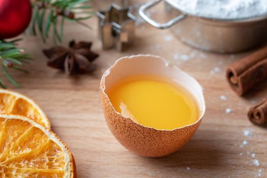 Fresh egg yolk, spices and other ingredients for Christmas baking