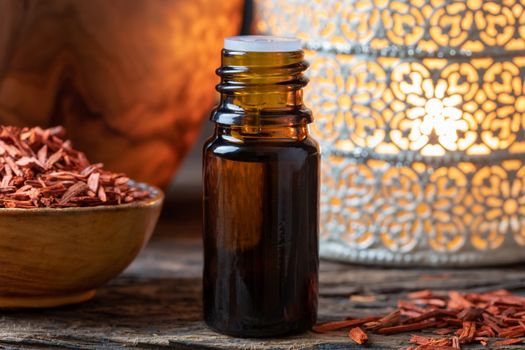 A bottle of essential oil with red sandalwood