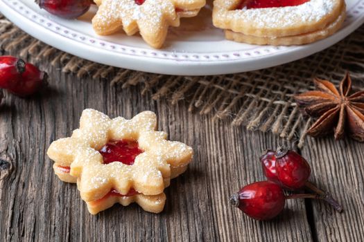 Traditional Linzer Christmas cookie on a rustic background