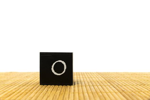 black number 1 block on bamboo underground and with isolated white background