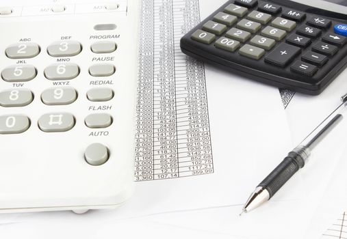 calculator and pen on a business background 