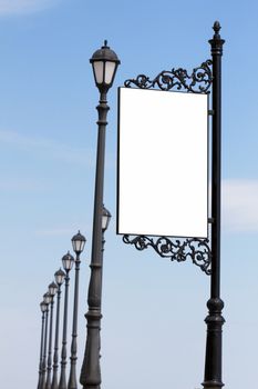 Blank billboard against blue sky, put your own text here 