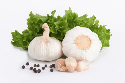 garlic decorated parsley leaves on white background 