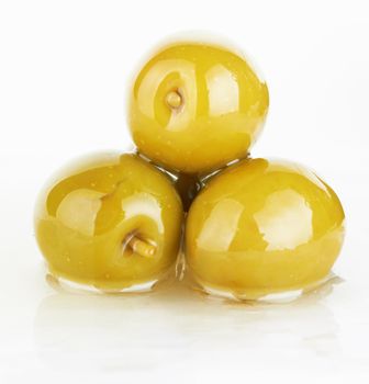 green olives on a white background  