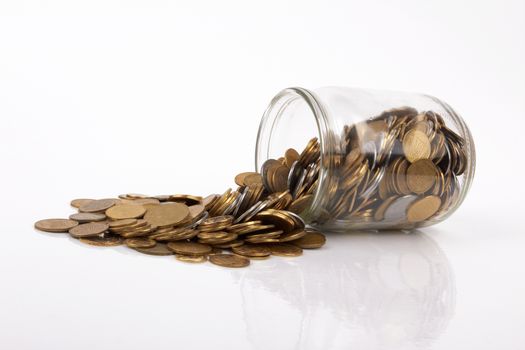 coins spilling from a money jar