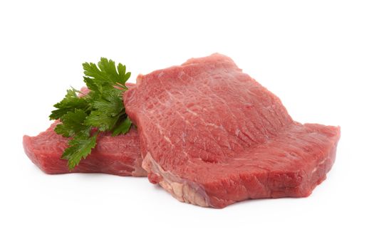 Two round steaks on a white background