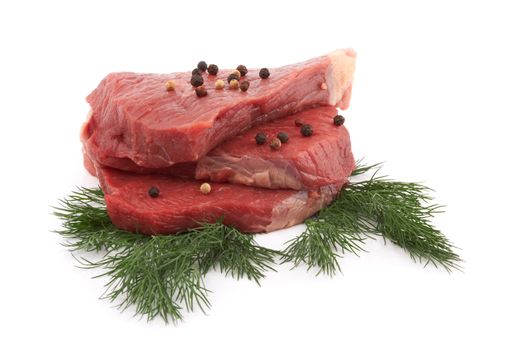 raw beef with spices on white background