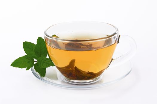 tea in glass cup with mint leaf